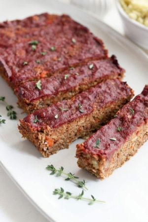 vegan meatloaf slices on a white plate