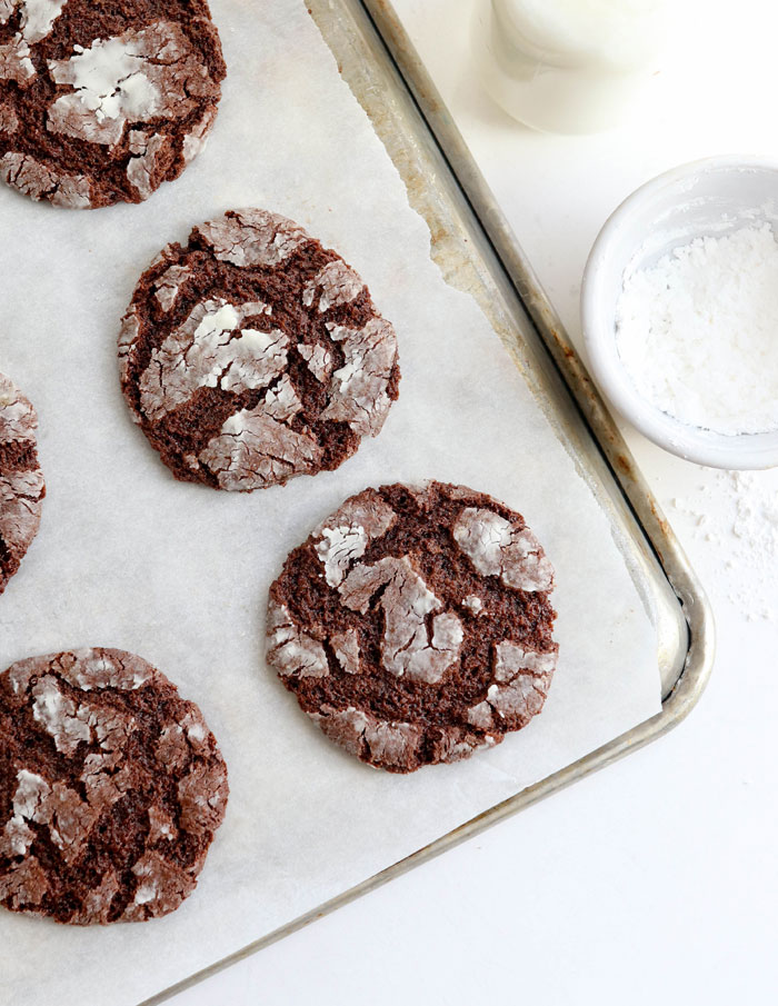 chocolate crinkle cookies on parchment paper