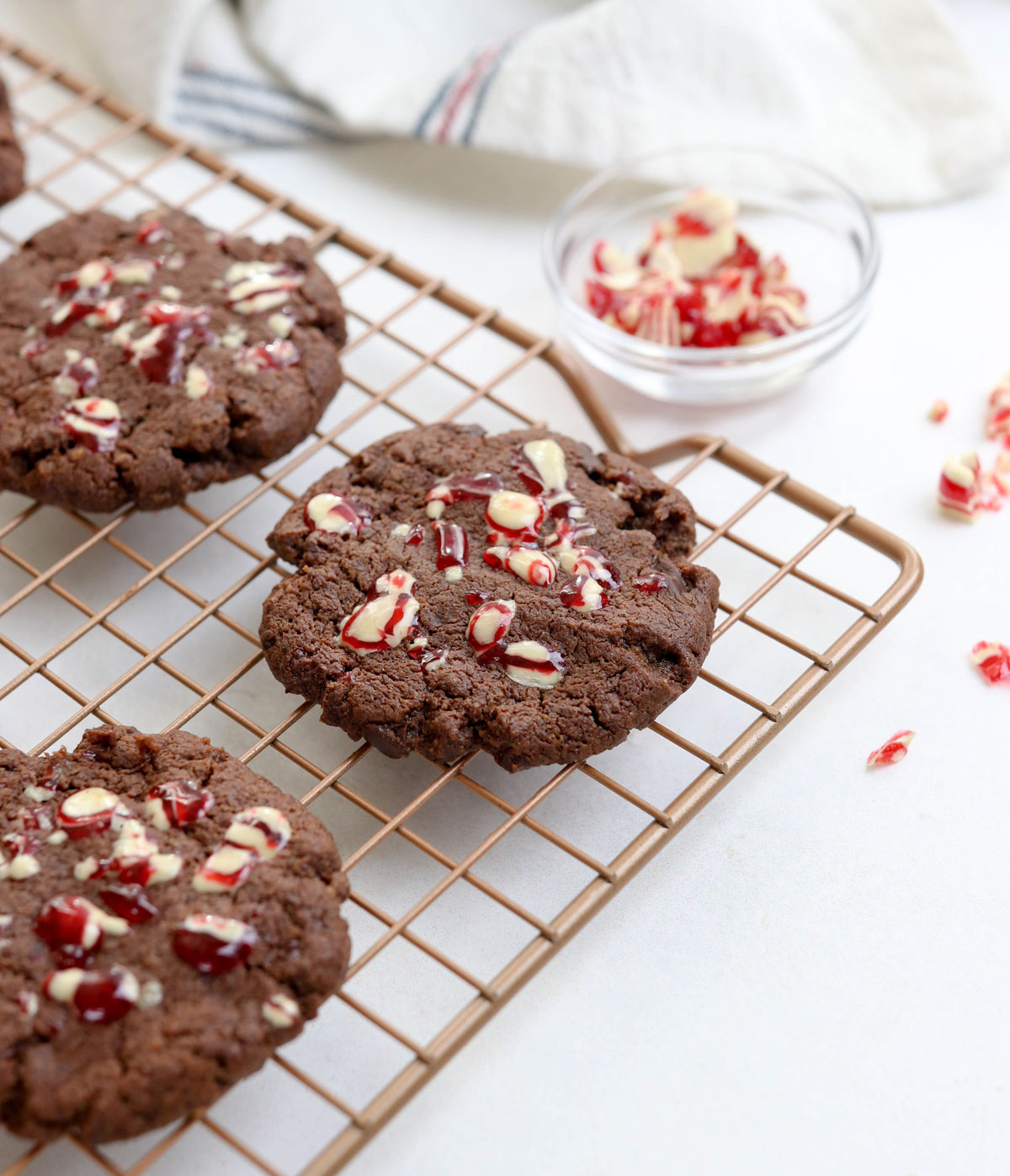 chocolate peppermint cookies with candy cane on top