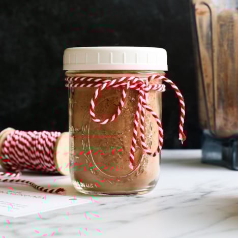 hot chocolate mix jar tied with ribbon for a gift.