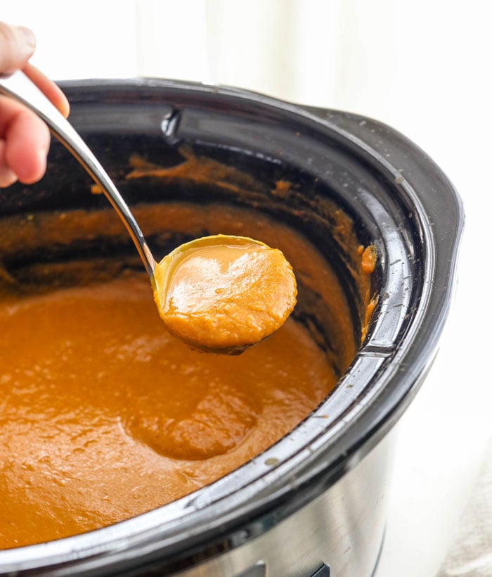 pumpkin soup in crockpot with ladle