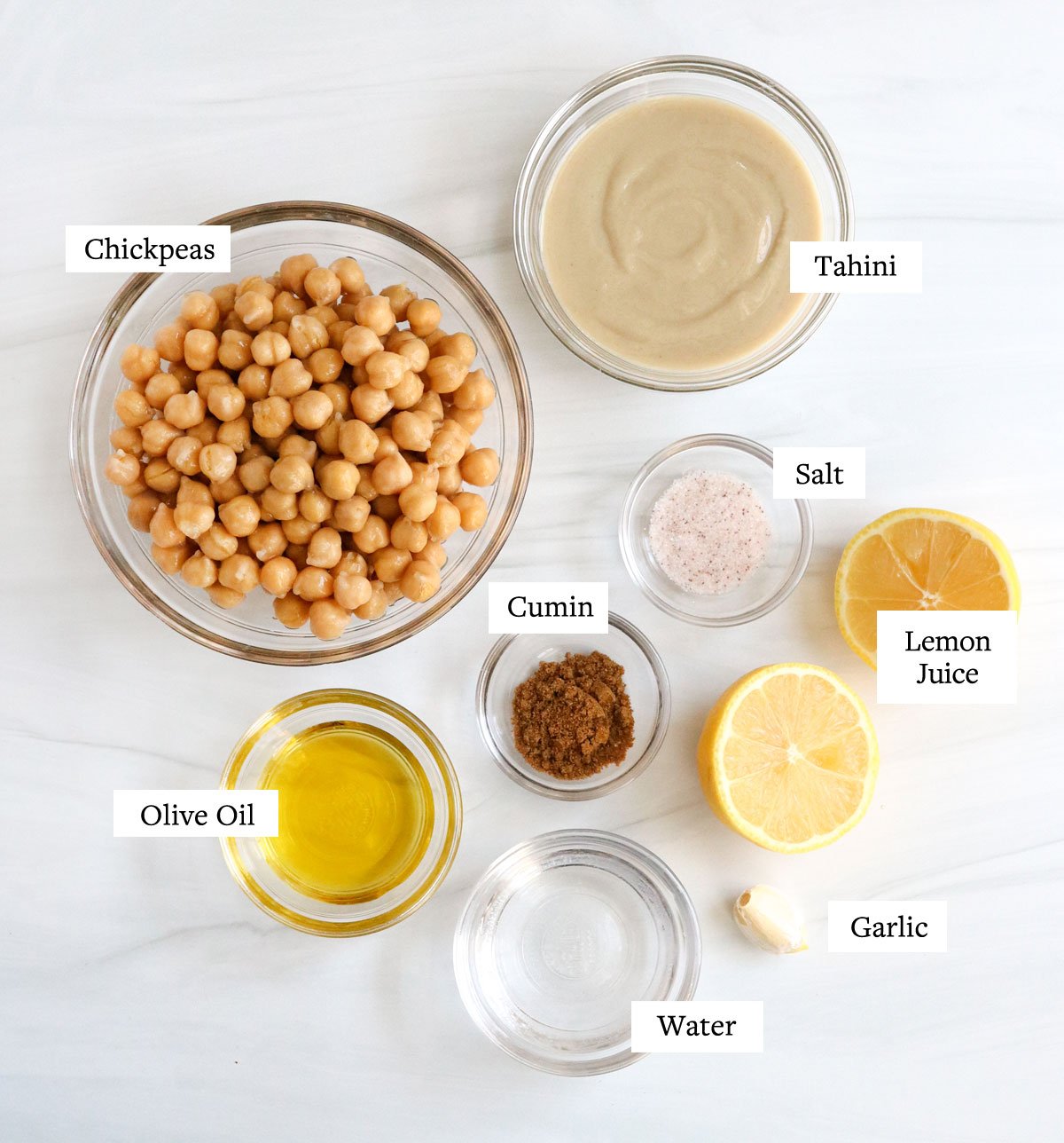 hummus ingredients in glass bowls.