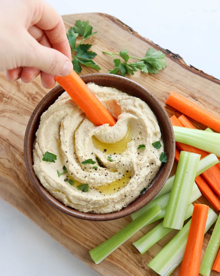 hummus with carrot dipped in