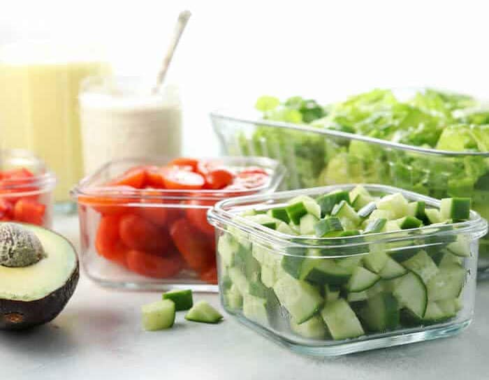 salad ingredients stored in glass containers