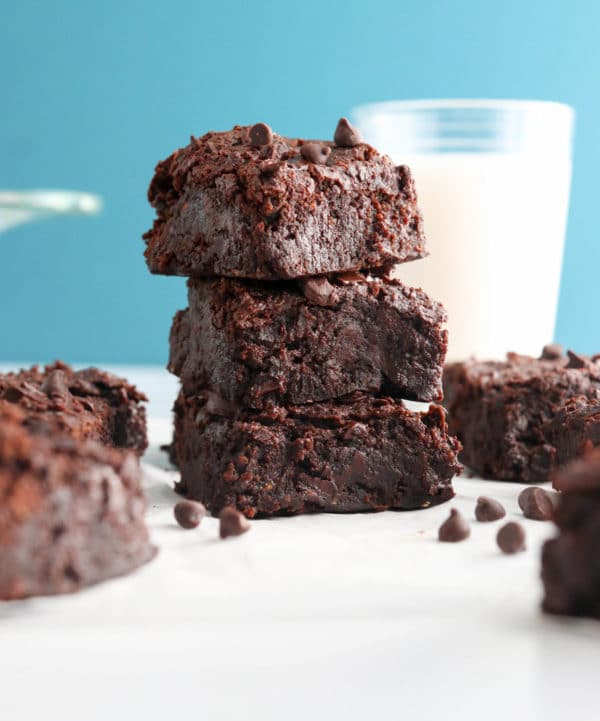 black bean brownies stacked with blue background