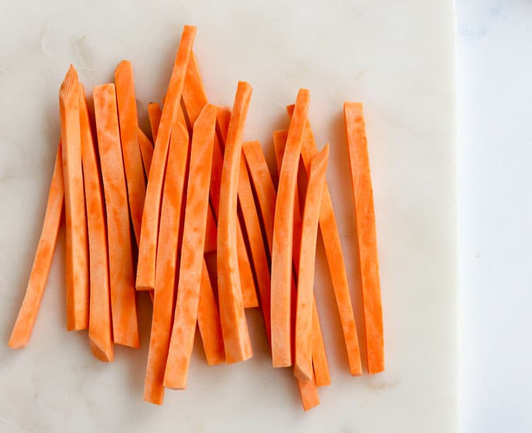 how to cut sweet potato fries on cutting board