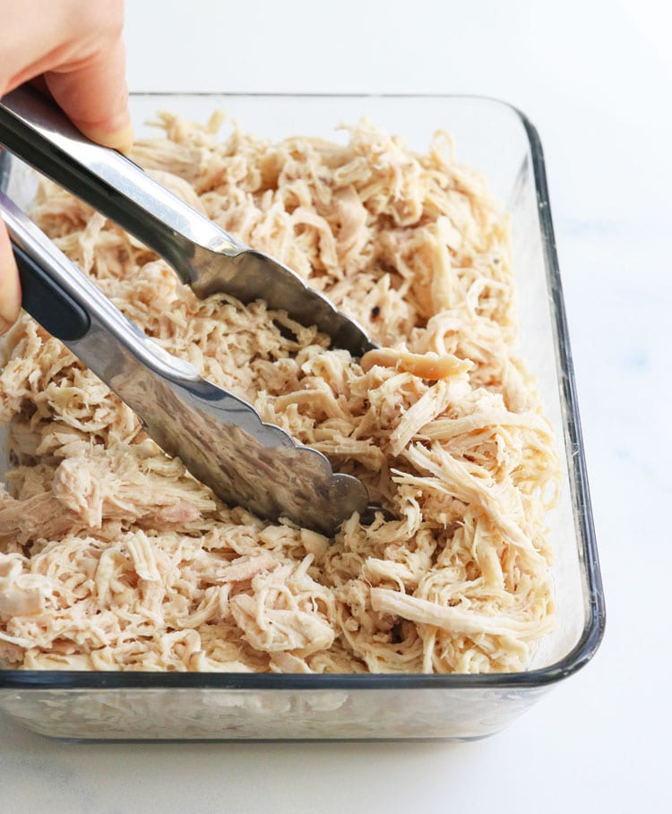 shredded chicken with tongs