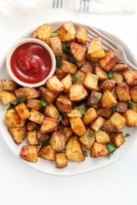air fryer potatoes with ketchup on plate