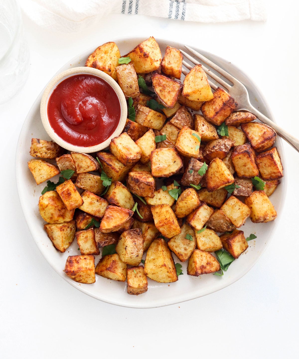 air fryer potatoes with ketchup on plate