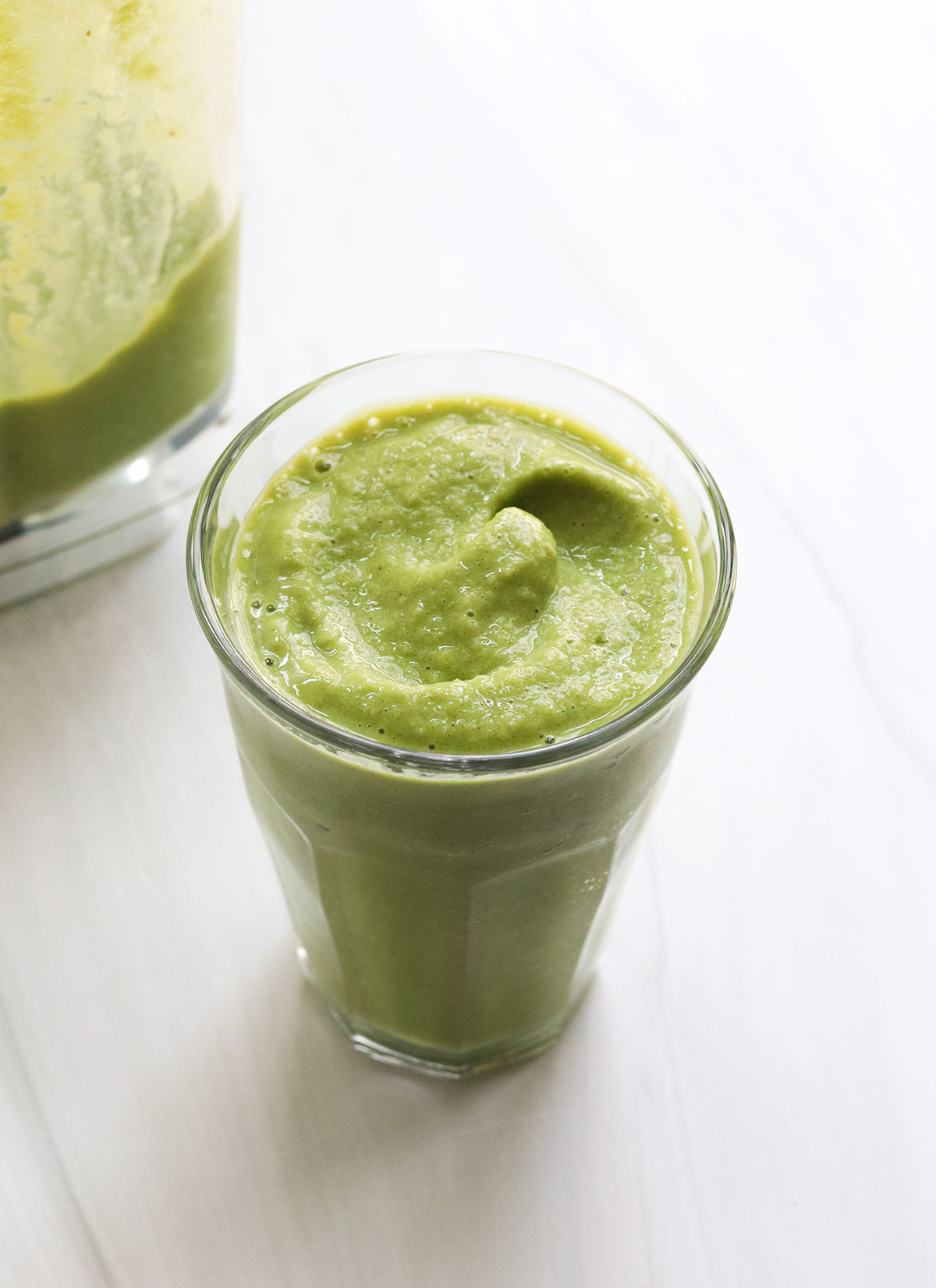 shamrock shake poured into a glass with a slushy texture.