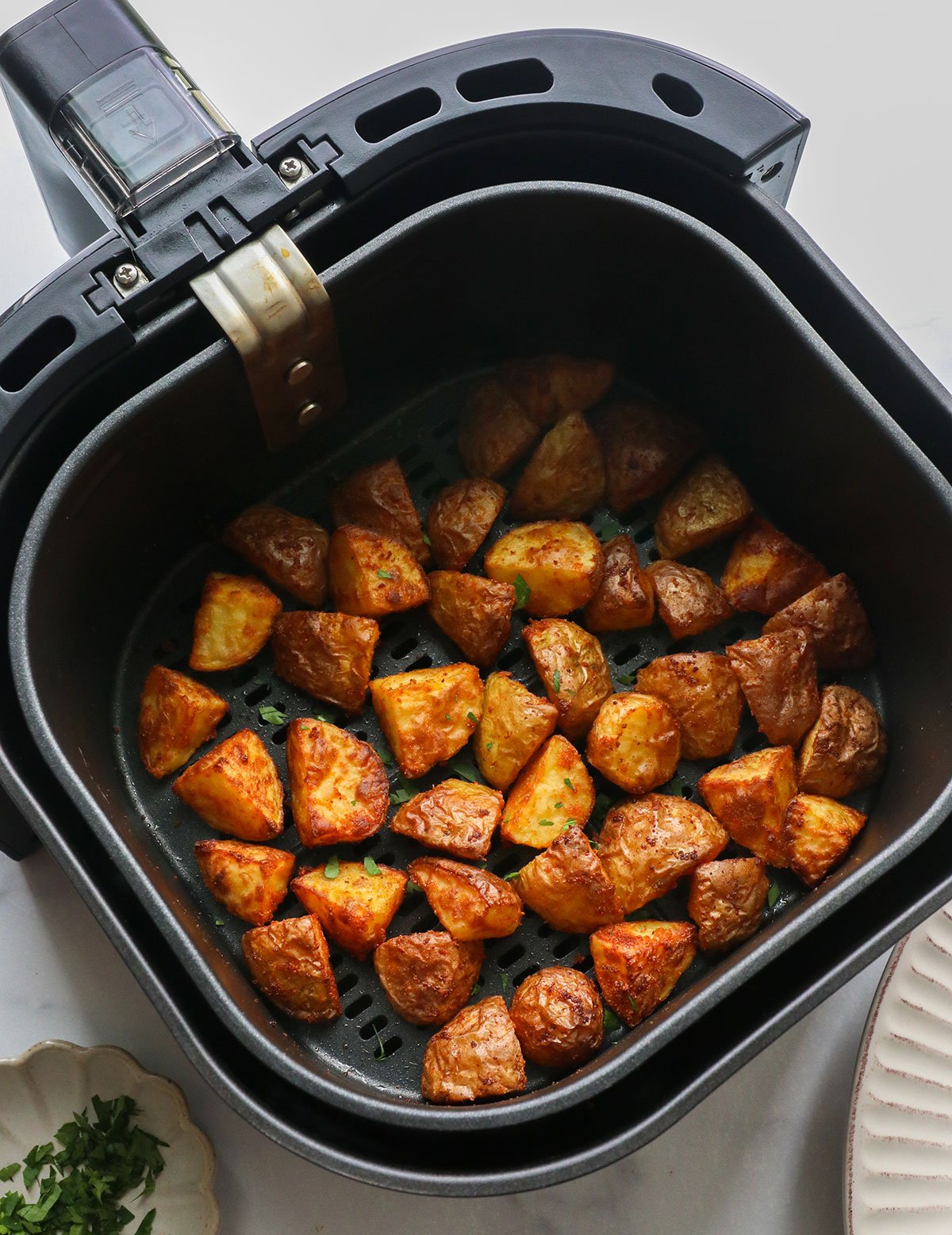 Finished potatoes in air frying basket