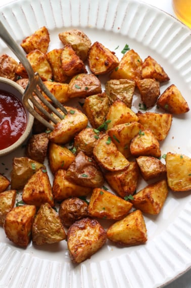 air fried potatoes on a white plate.