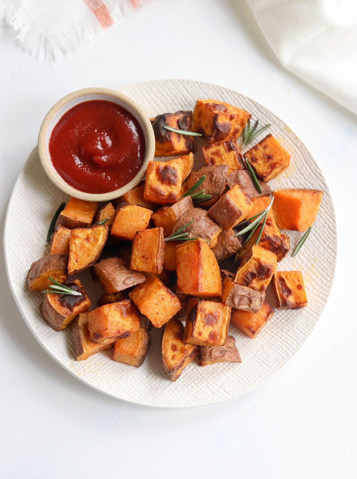 air fryer sweet potatoes cubed on plate