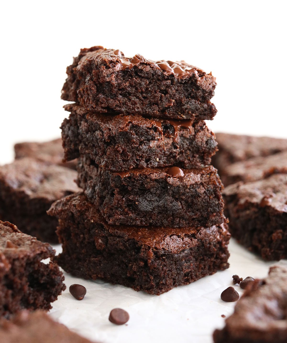 almond flour brownies stacked with white background.