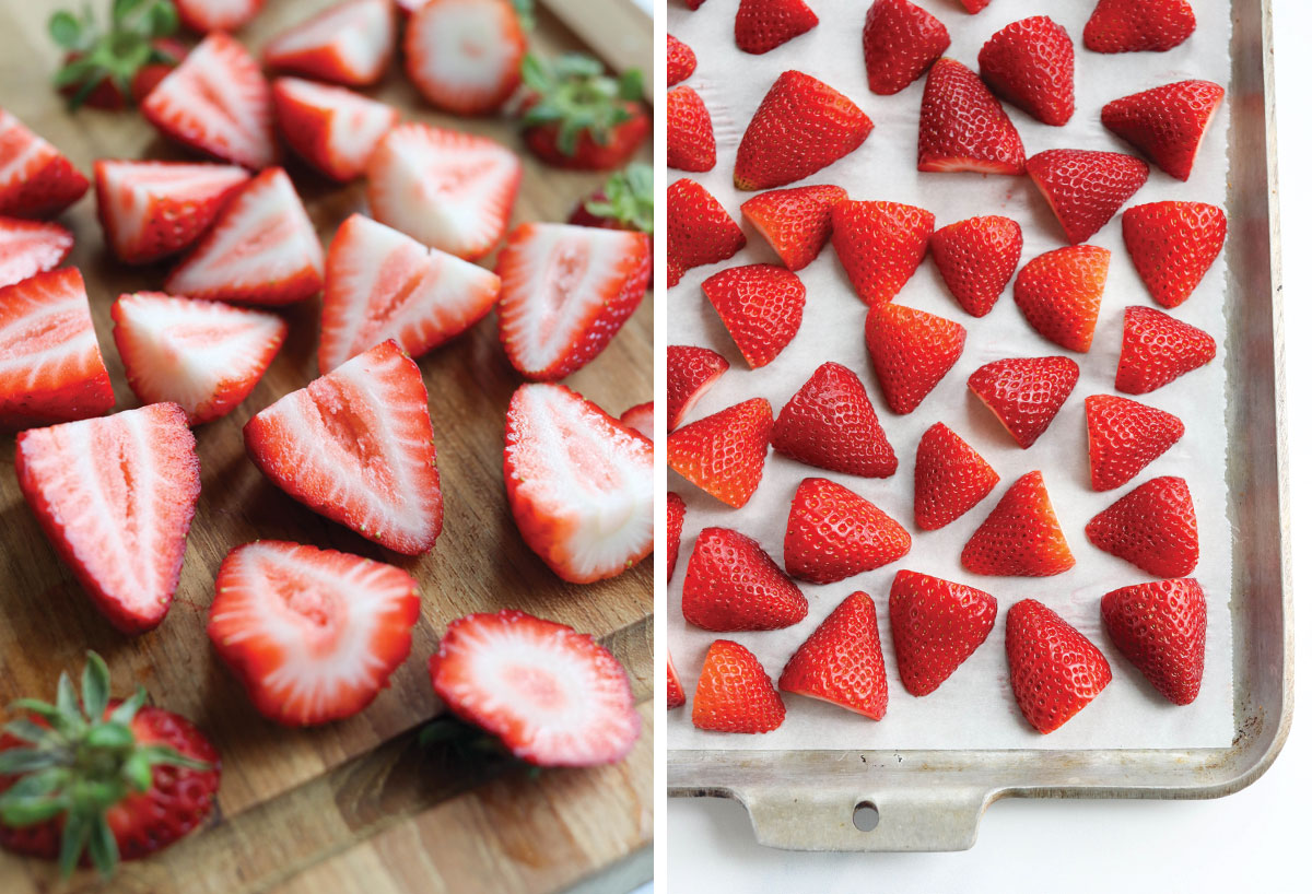 strawberries cut in half and on the pan