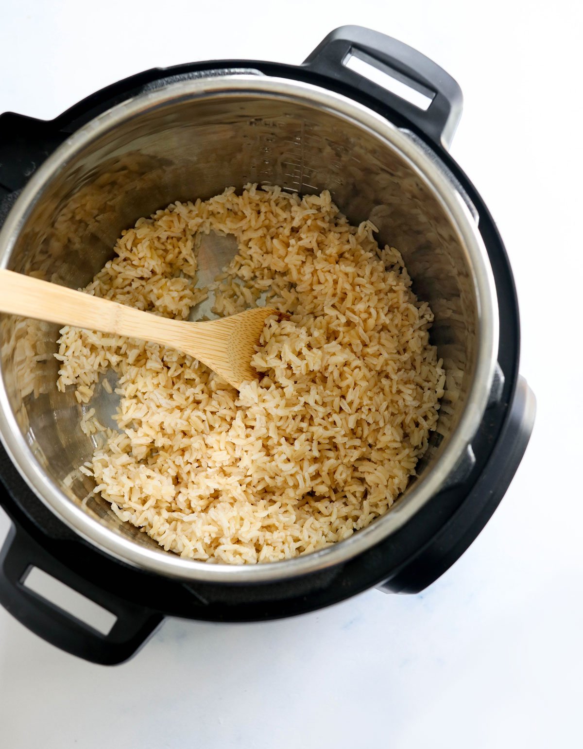 cooked brown rice in the bottom of Instant Pot