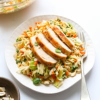 cabbage salad served with chicken on top.