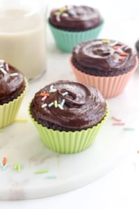 chocolate almond flour cupcakes with frosting and sprinkles