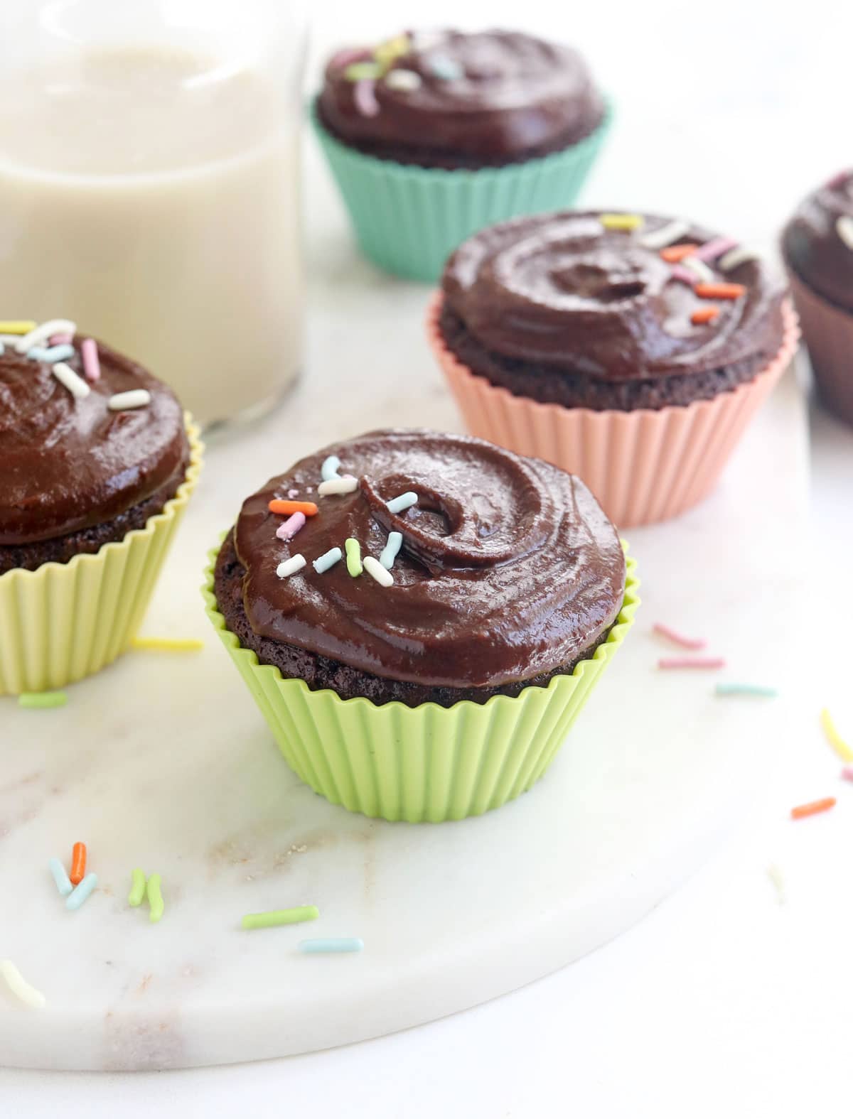 chocolate almond flour cupcakes with frosting and sprinkles