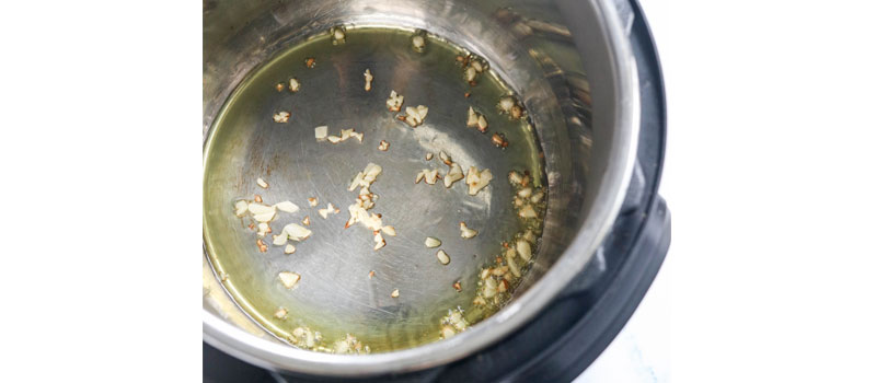 garlic sauteed in olive oil in pressure cooker
