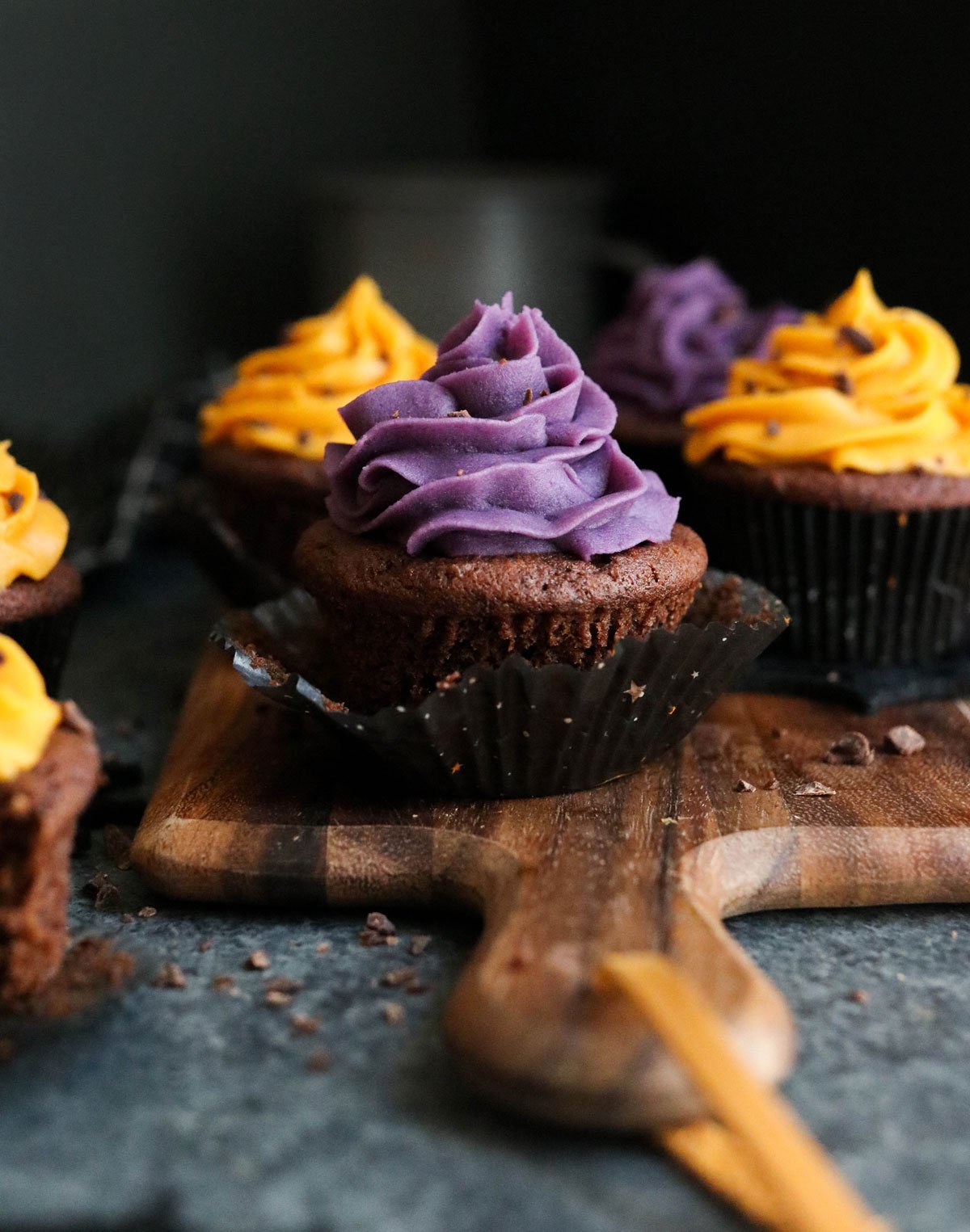 purple frosting on chocolate cupcake