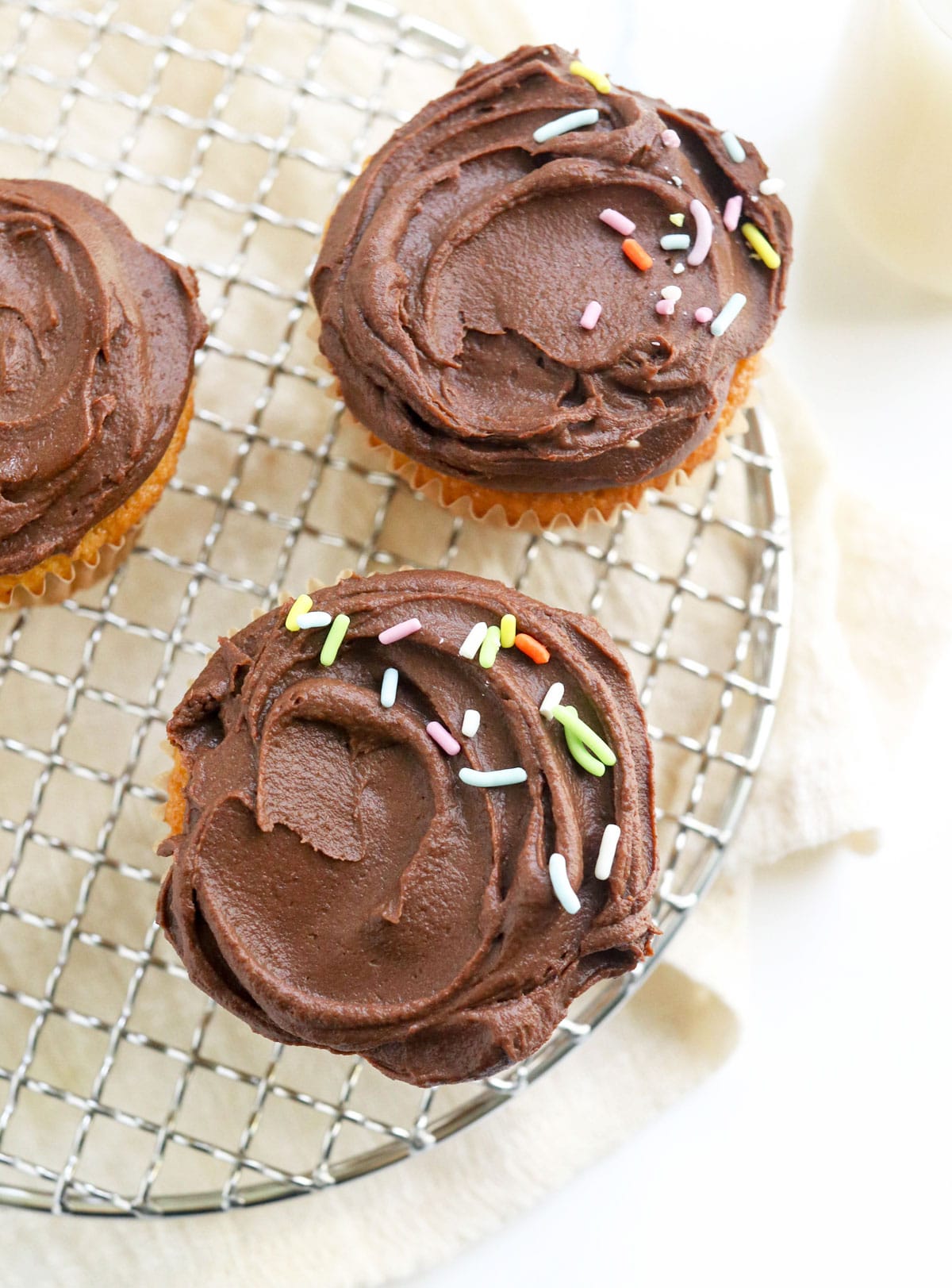 chocolate frosting overhead with sprinkles