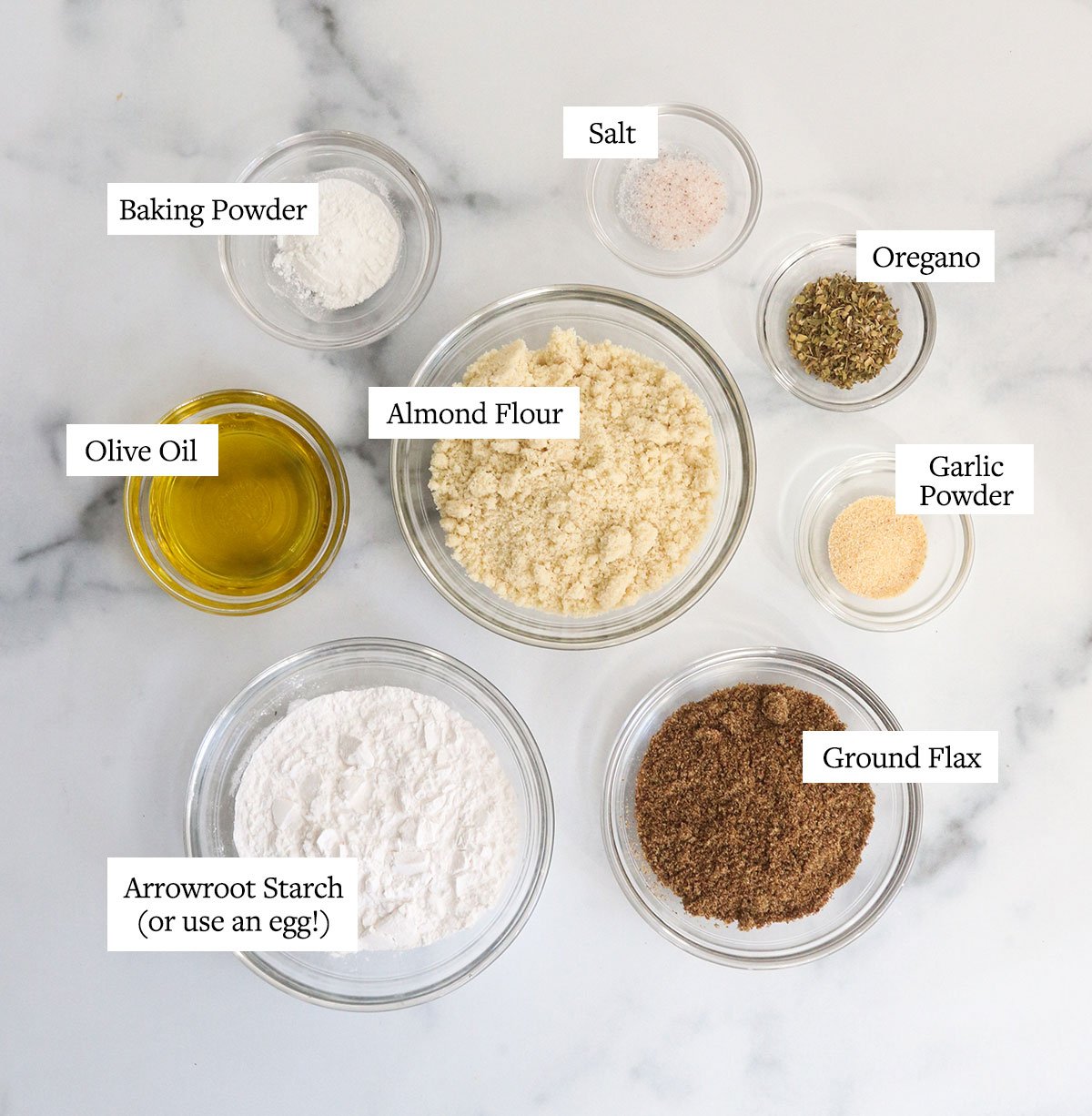 almond flour pizza crust ingredients labeled on white surface.