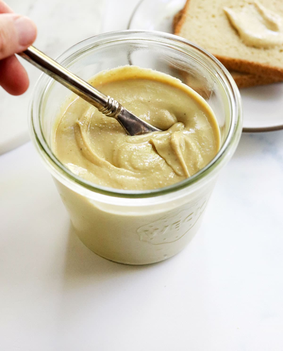 cashew butter with knife dipped in