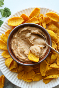 bean dip served with organic corn chips and fresh cilantro.