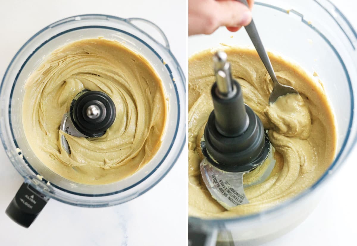 silky smooth cashew butter in food processor with a spoon inside