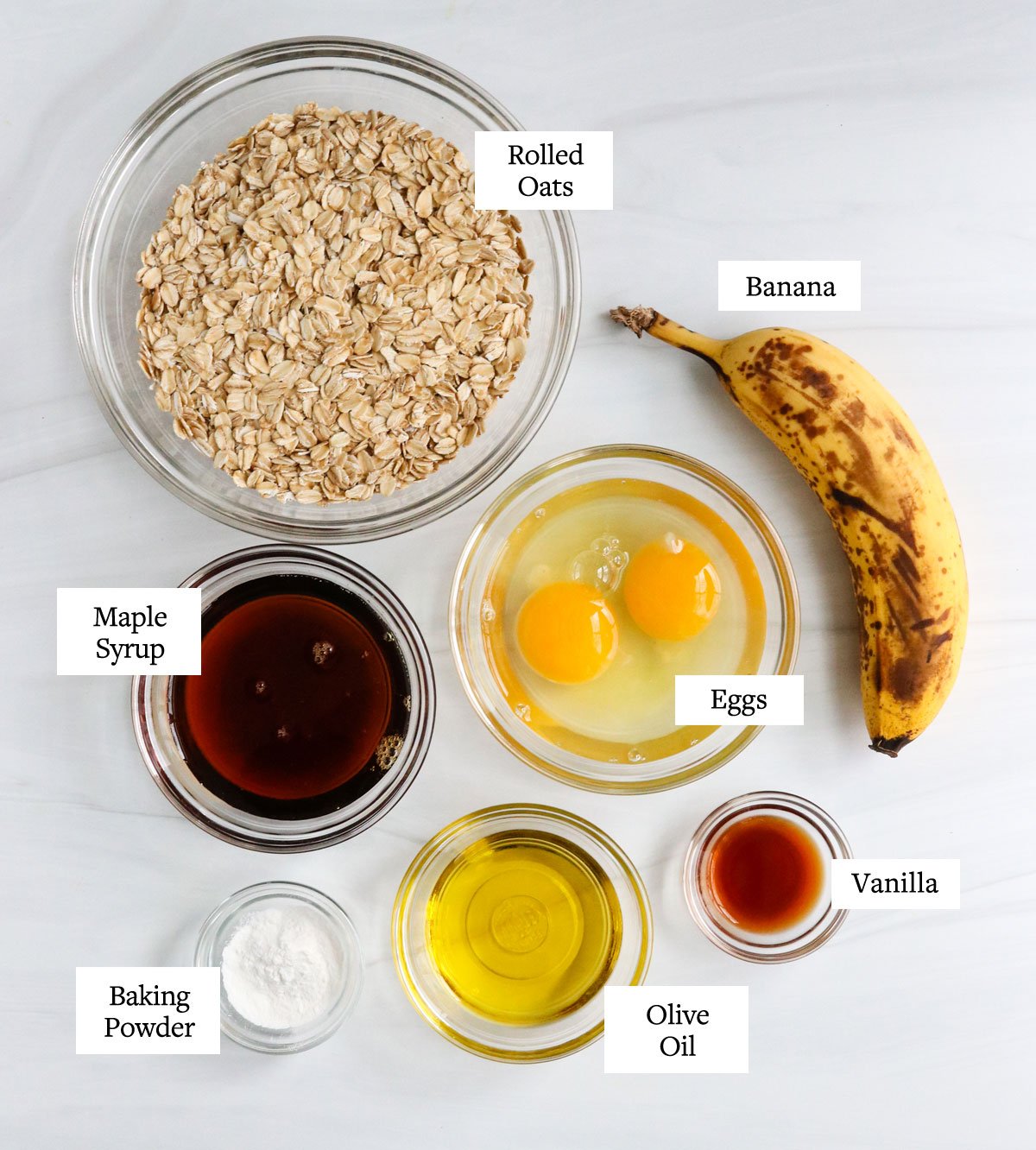 banana oatmeal pancake ingredients in glass bowls.