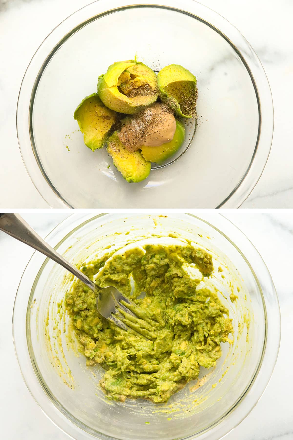 avocado mashed in a glass bowl with mustard and lemon juice. 