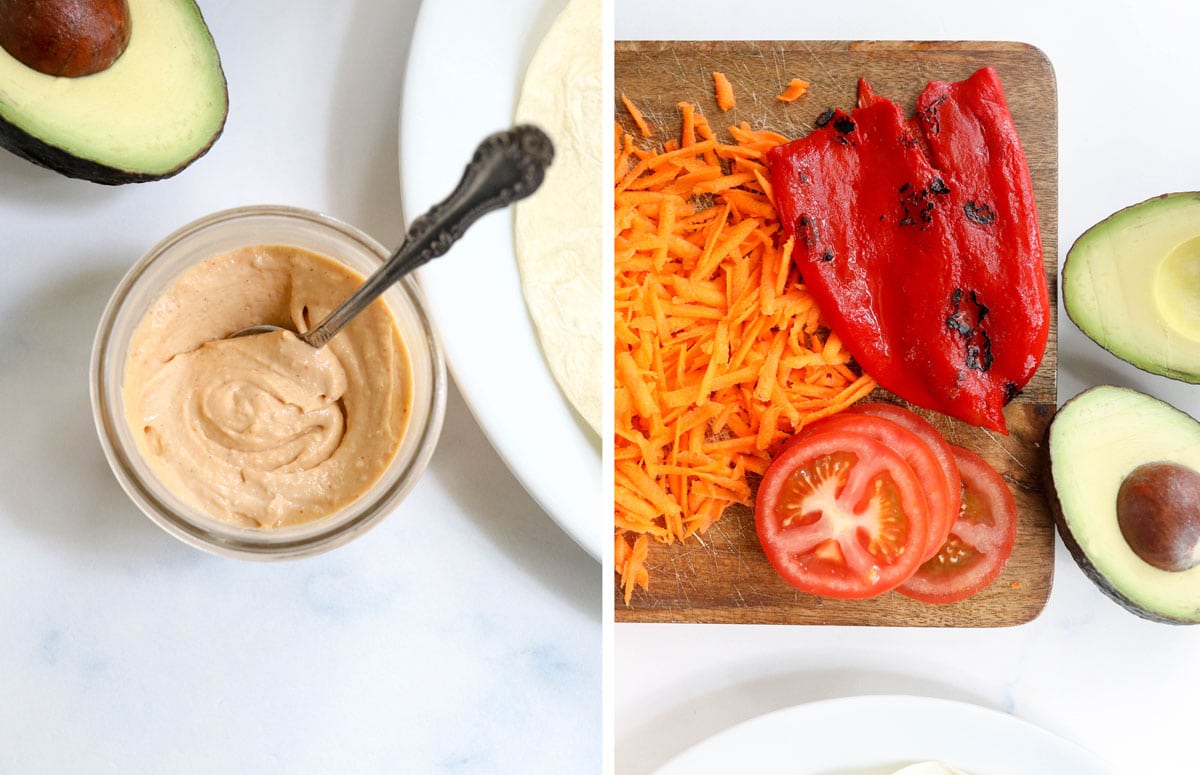 sriracha mayo in a jar with shredded carrots, roasted red pepeprs, tomatoes and avocado on a cutting board