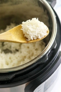 white rice on spoon over Instant Pot