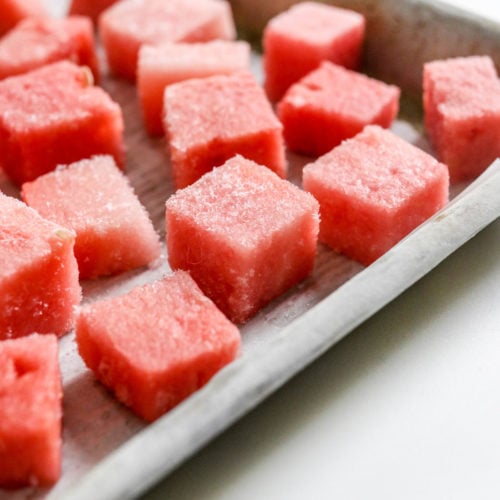 frozen watermelon pieces on a pan