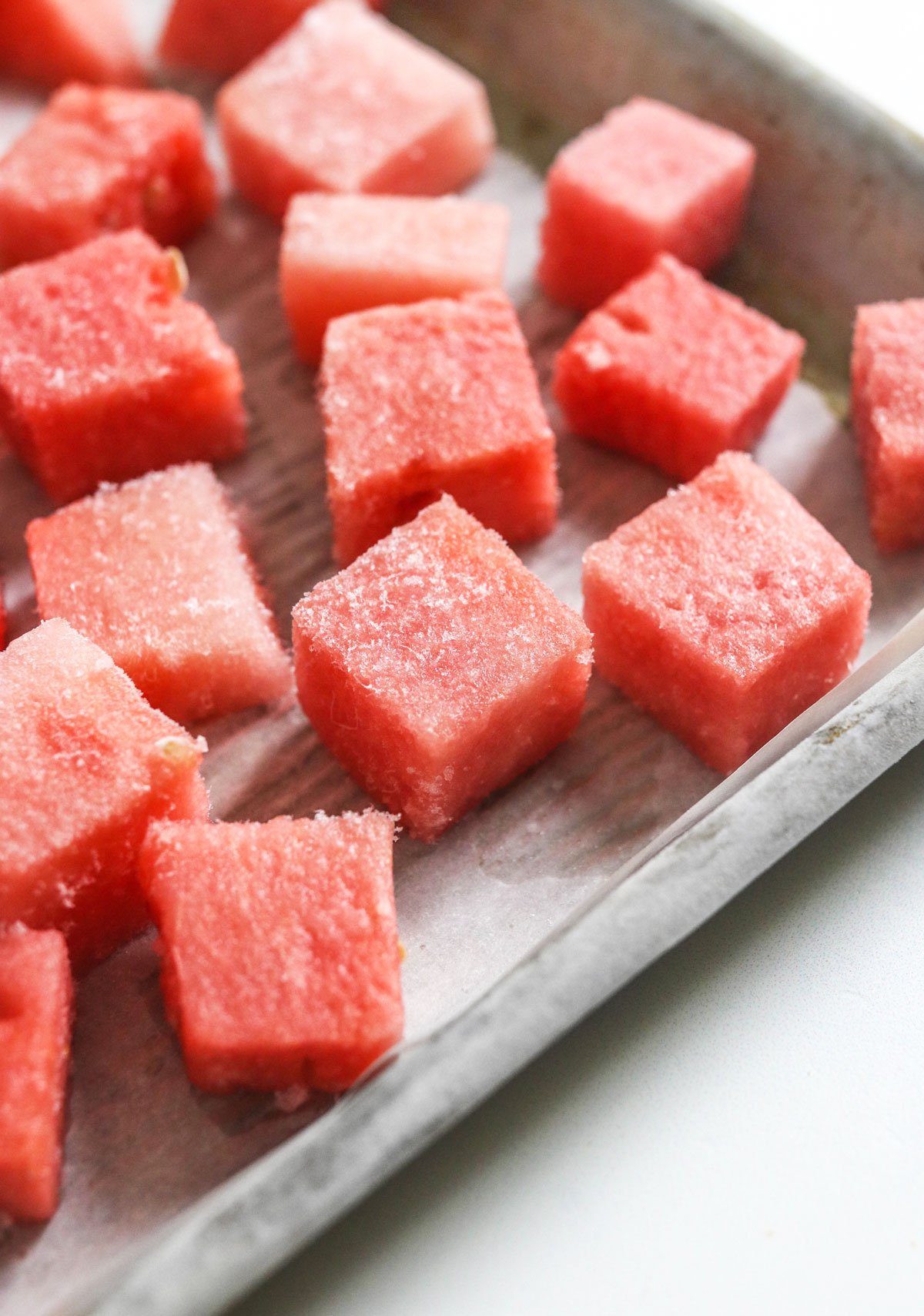 frozen watermelon chunks on pan