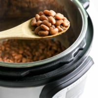 spoon full of beans over the Instant Pot