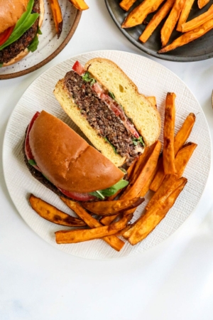 veggie burger cut in half with french fries