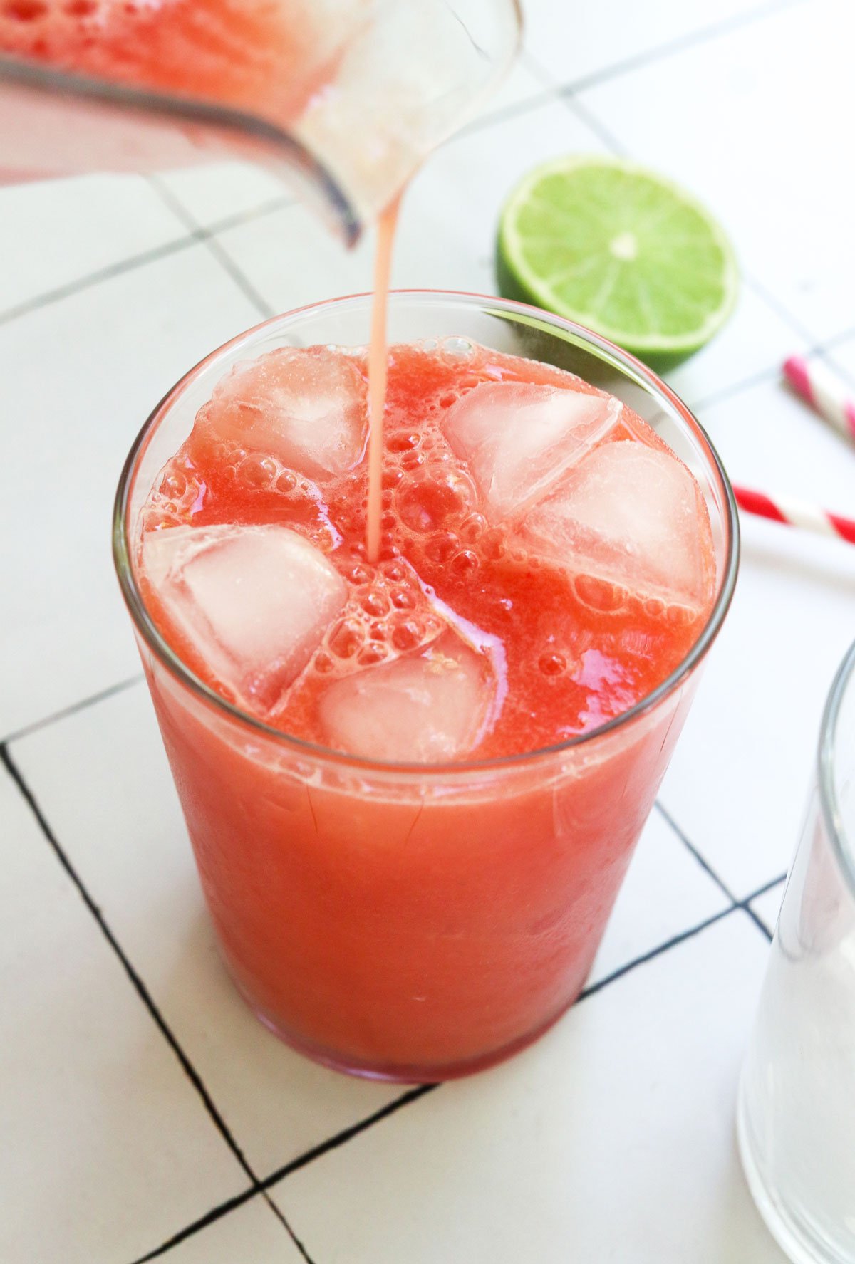 watermelon juice poured into a glass of ice.