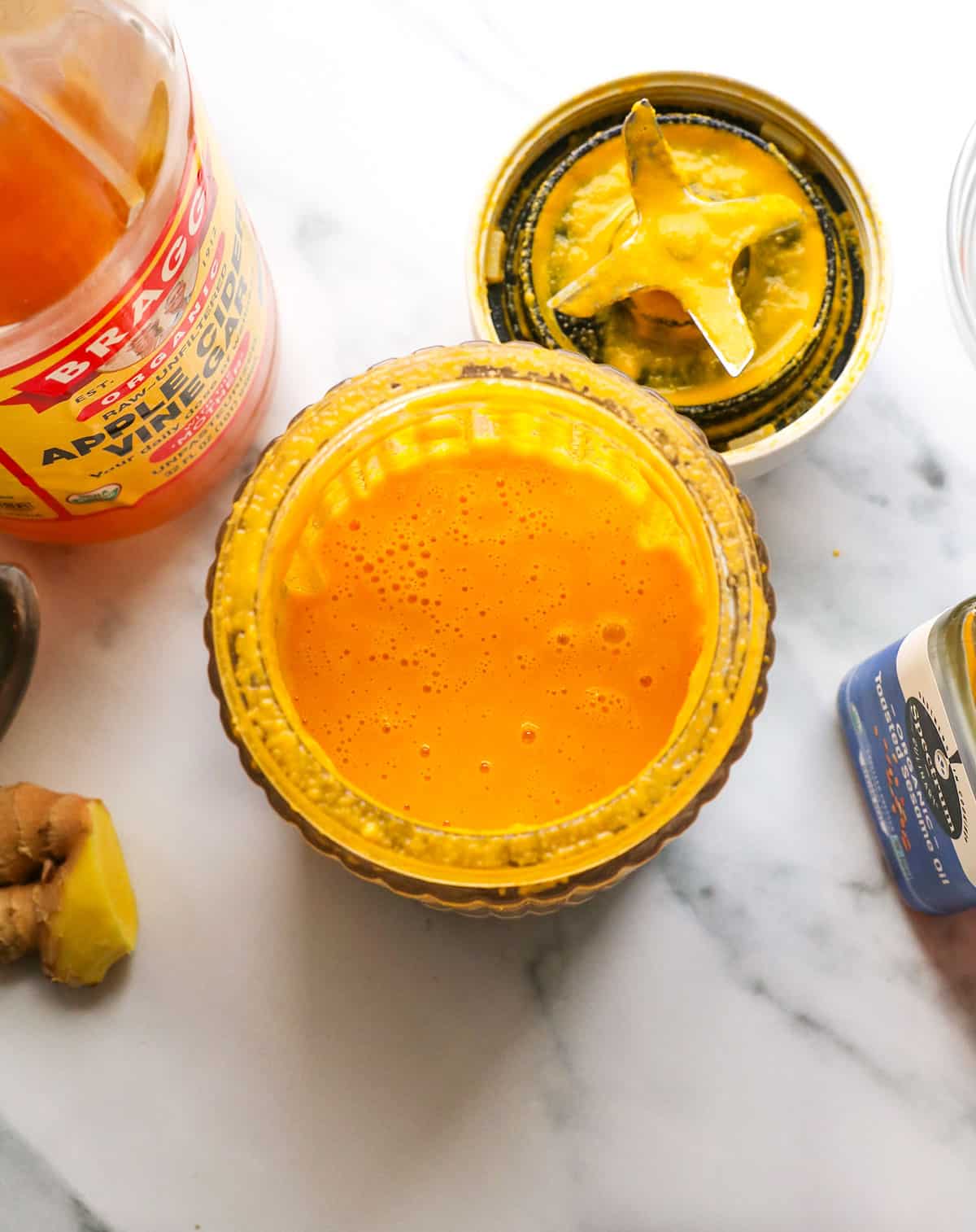 carrot ginger dressing after blended in a small container.