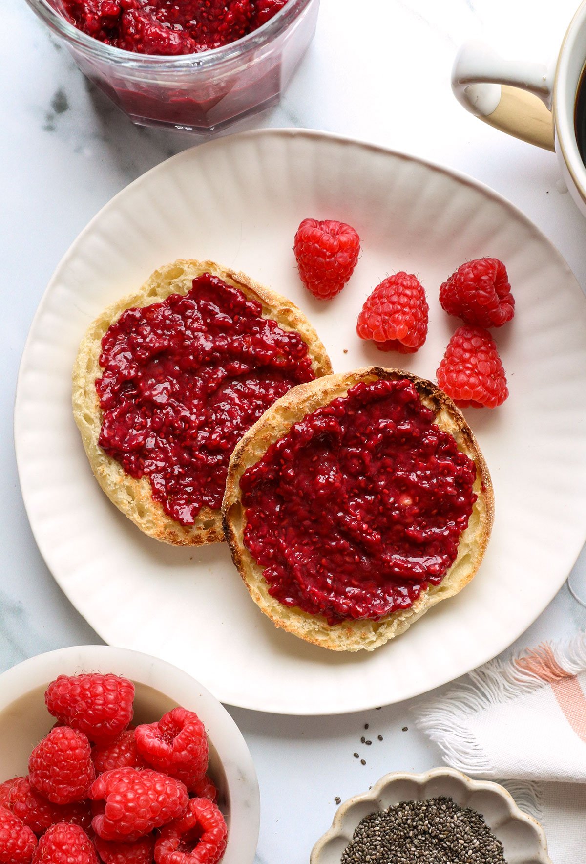 chia seed jam spread on english muffin halves. - 6