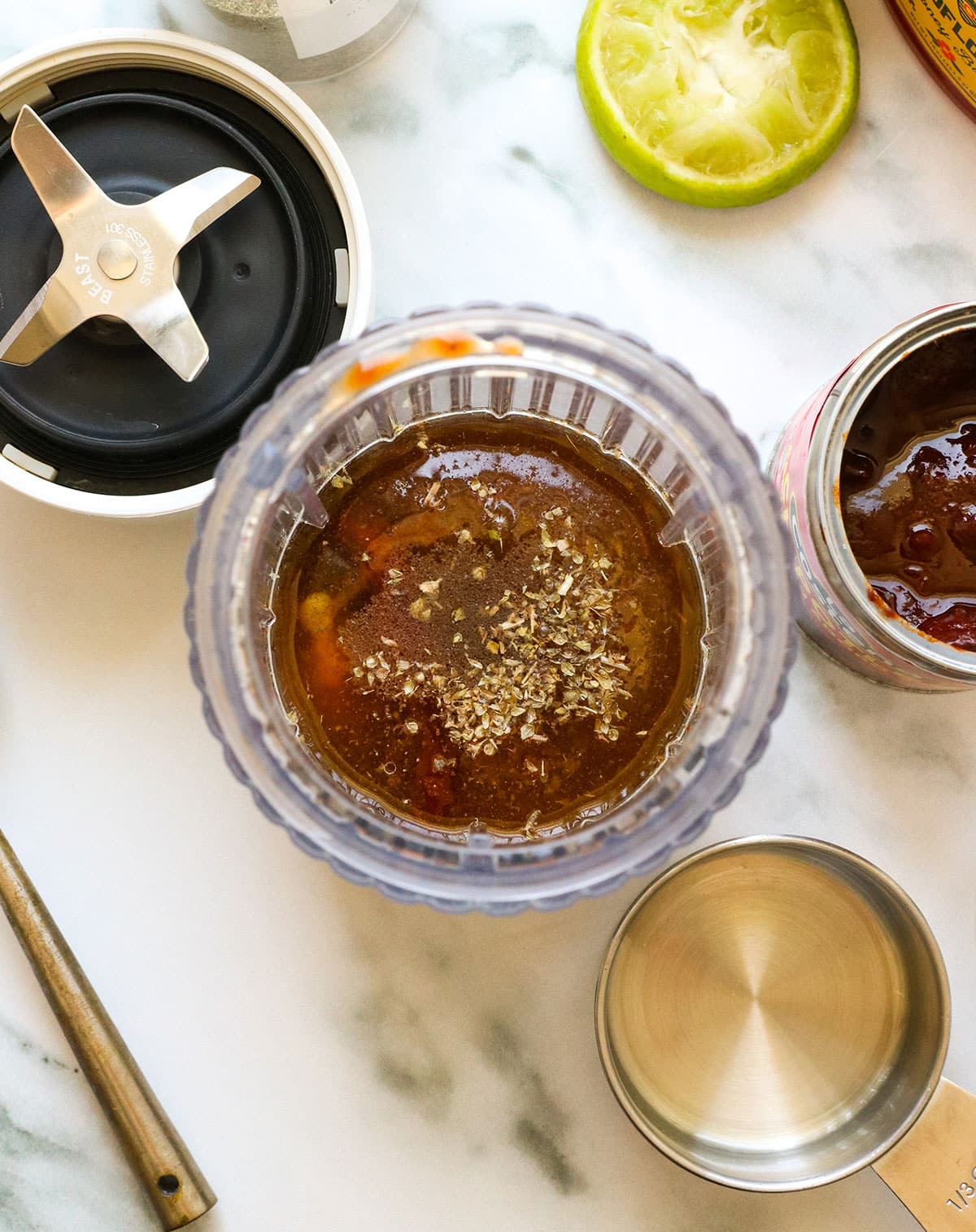 chipotle pepper, oil, vinegar, and spices added to a small blender.