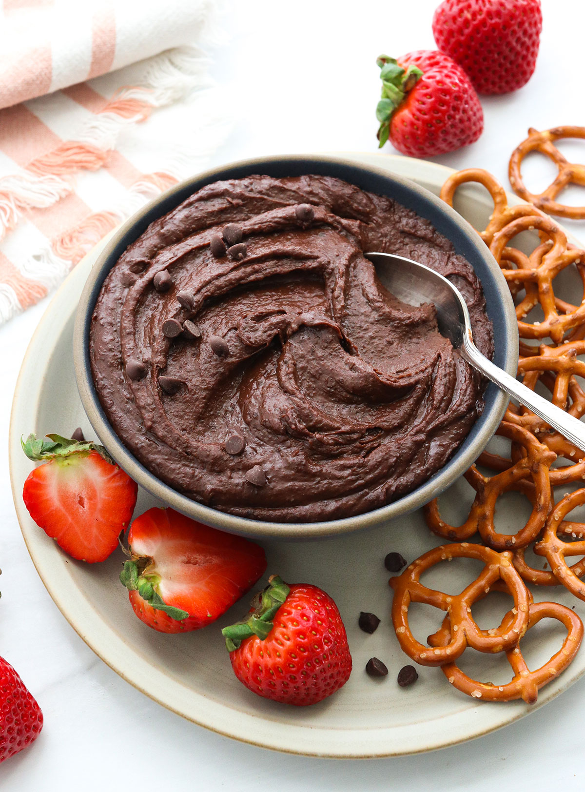 chocolate hummus served with a spoon.