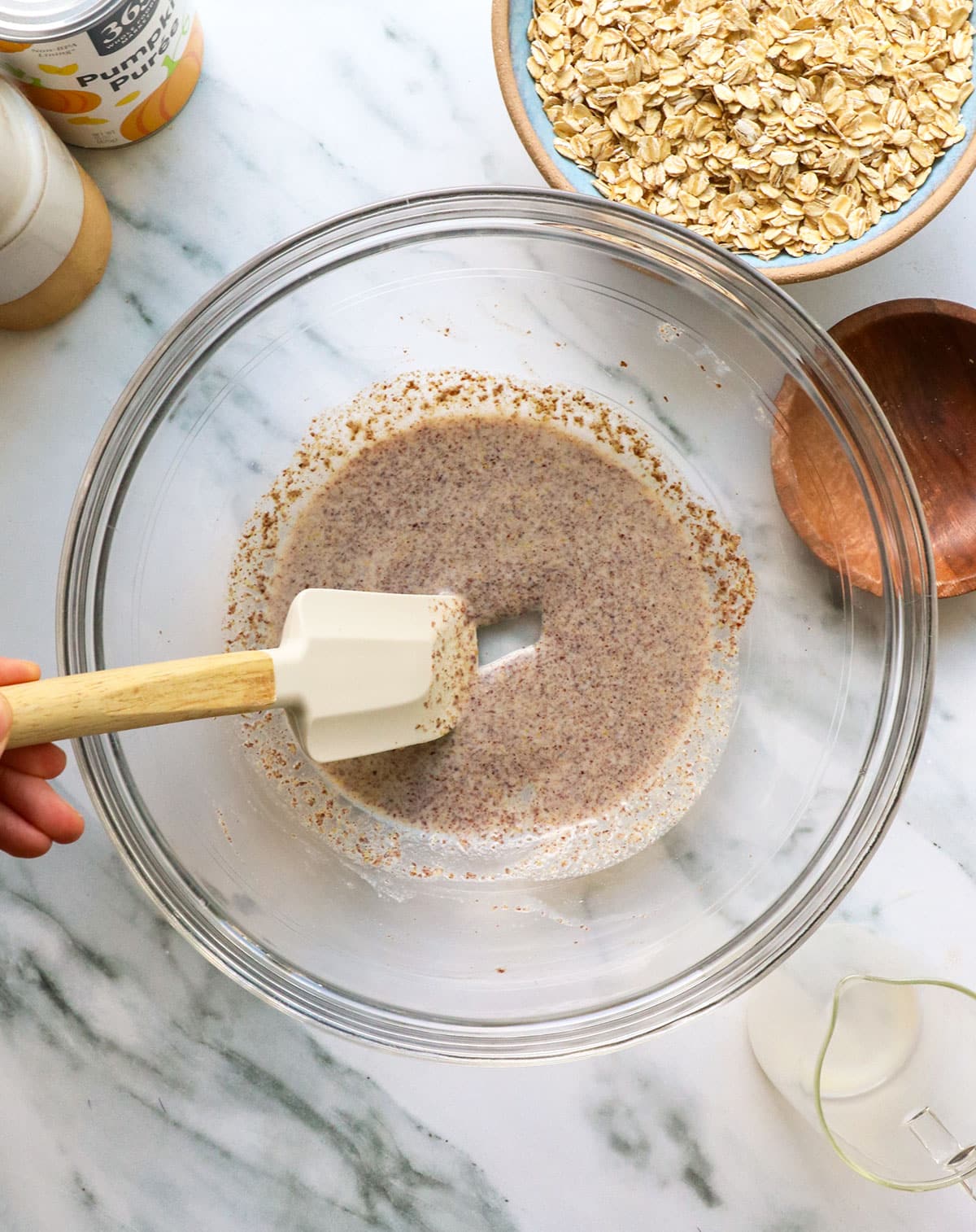 ground flax seeds mixed with milk in a glass bowl.