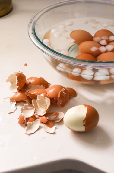 peeled hard boiled egg near a bowl of ice on my kitchen counter.