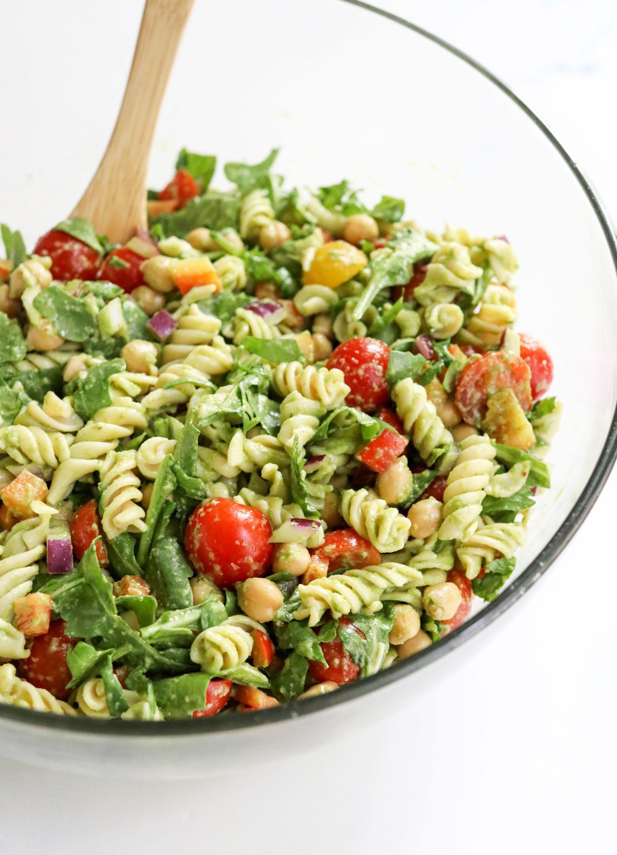 pesto pasta salad mixed together in large bowl