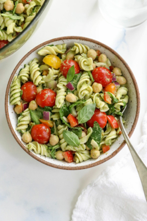 pesto pasta salad serving with a fork