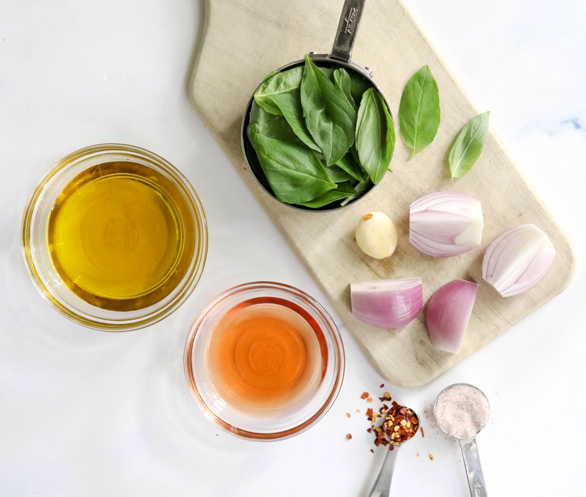 basil vinaigrette ingredients on cutting board