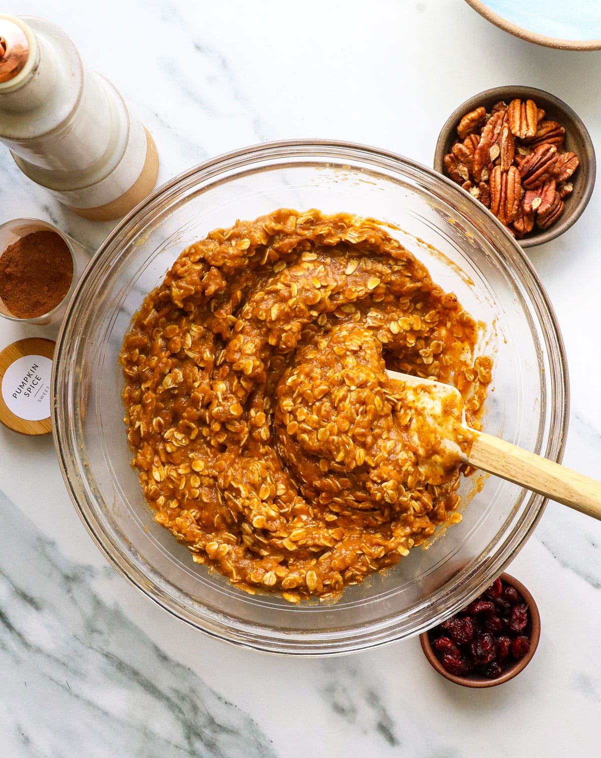 pumpkin oatmeal mixture stirred with a spatula.