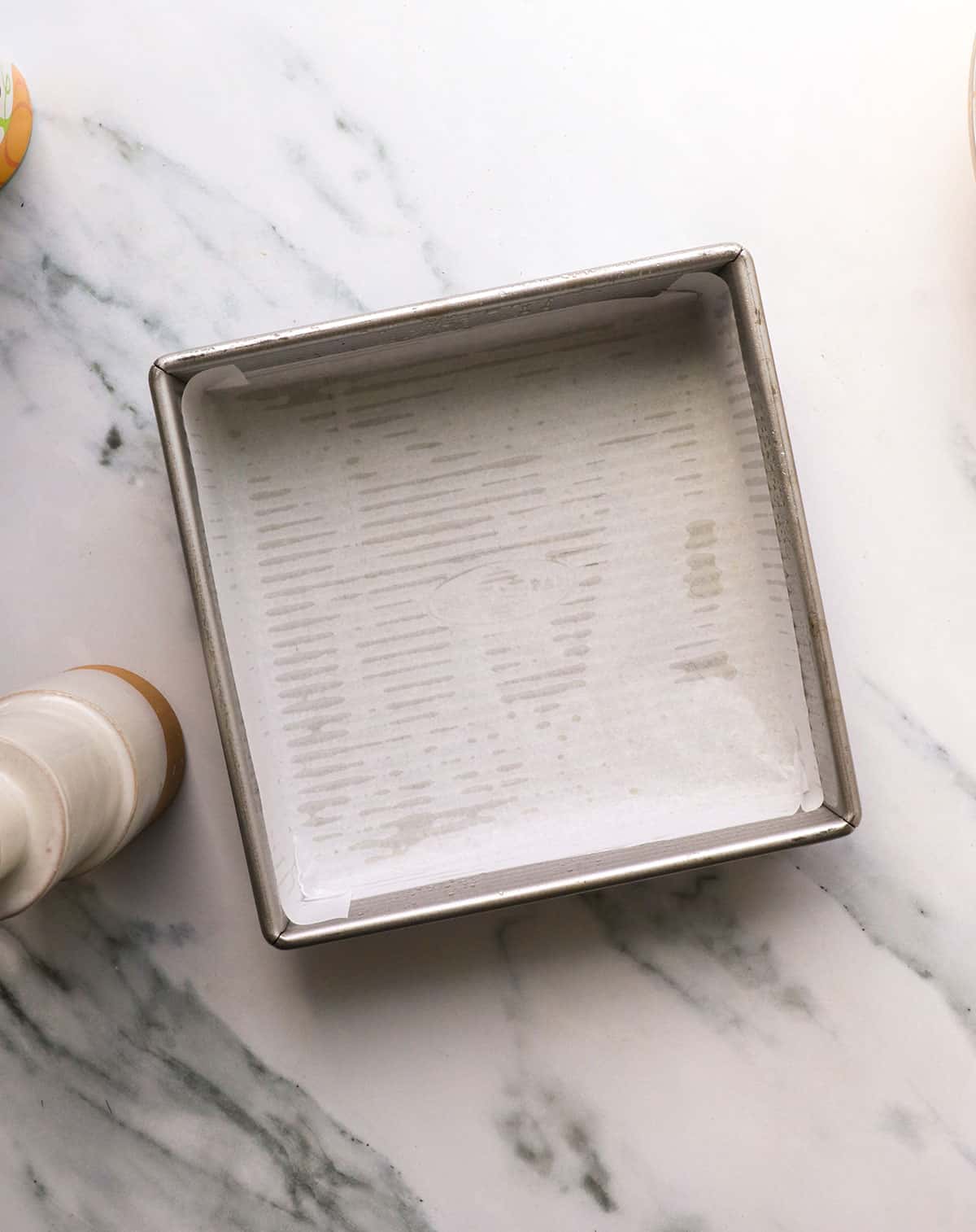 square pan lined with parchment paper.